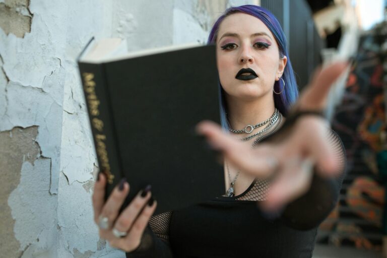 Woman in Black Top Holding a Book