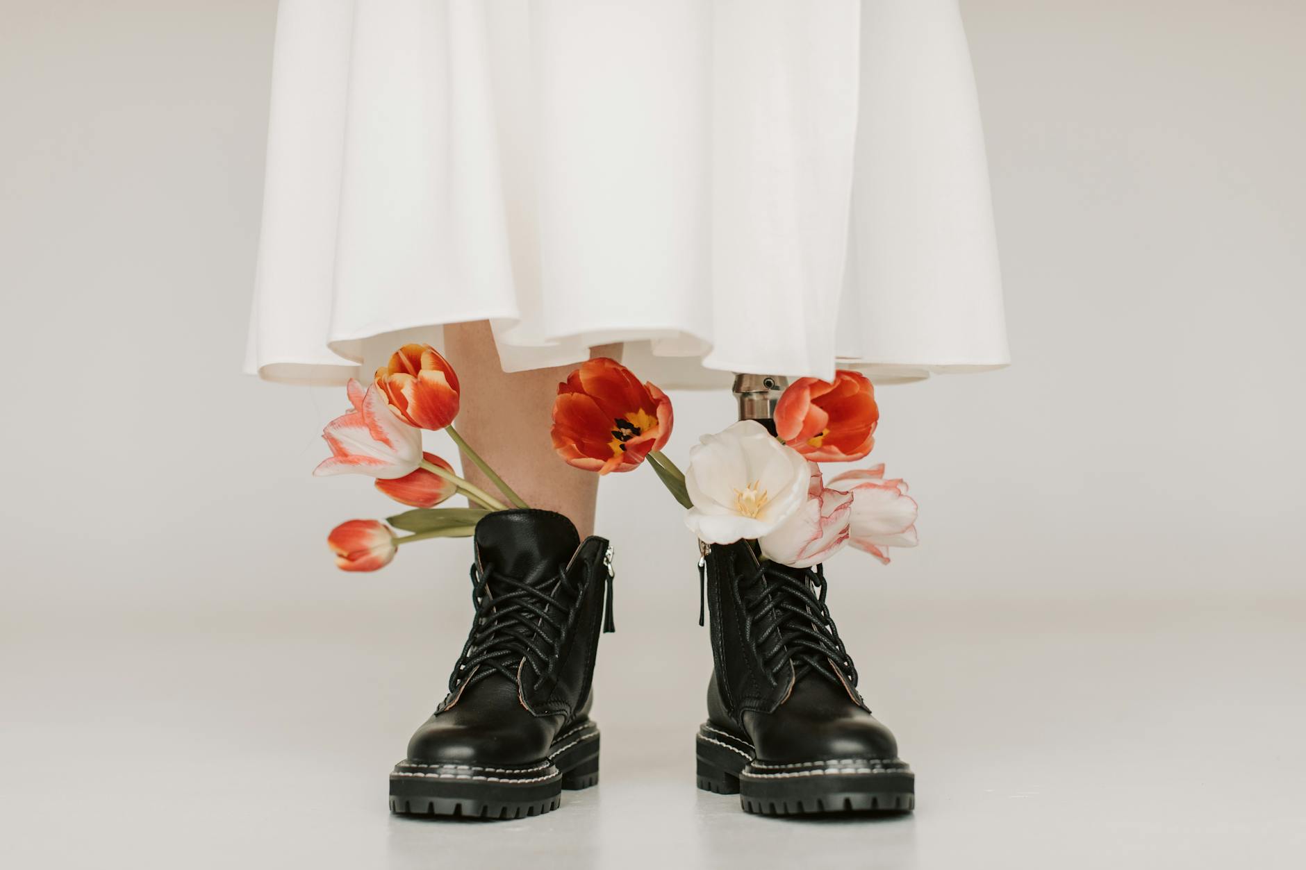 Conceptual image of a prosthetic leg with flowers, highlighting beauty and inclusivity.