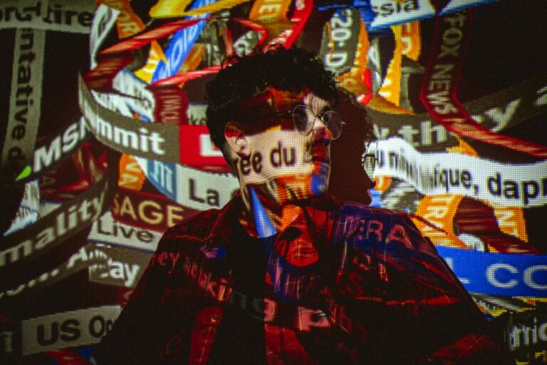 Conceptual photo of a person with news ticker projections on their face and body.