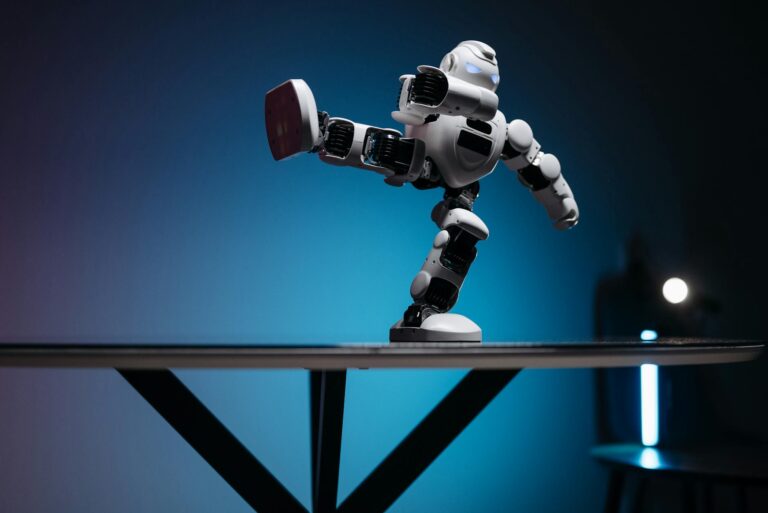 A modern robot toy balancing dynamically on one leg, set against a blue gradient background.